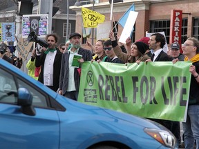 Climate activists are seen blocking traffic along Memorial Drive and 10th St. in Kensington as they join other Canadians in a global climate strike led by "Extinction Rebellion." Many motorists trying to leave the downtown core during rush hour were heard honking horns in disapproval. Monday, October 7, 2019.