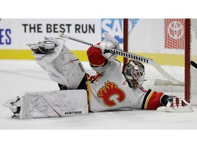 CP-Web.  Calgary Flames goalie Cam Talbot stops a shot from the San Jose Sharks during the first period of a preseason NHL hockey game Thursday, Sept. 26, 2019, in San Jose, Calif.