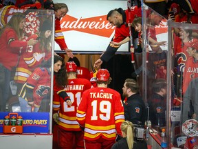 Fans try to console their team as the Calgary Flames file off the ice after losing in Game 5 to the Colorado Avalanche on April 19, 2019.