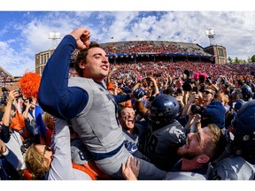 Oct 19, 2019; Champaign, IL, USA; Illinois Fighting Illini place kicker James McCourt (17) is congratulated by teammates after kicking the game winning field goal against the Wisconsin Badgers at Memorial Stadium. Mandatory Credit: Patrick Gorski-USA TODAY Sports ORG XMIT: USATSI-404270