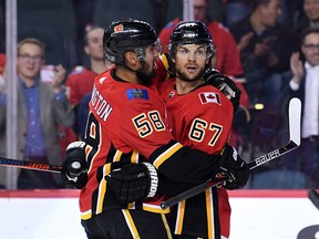 Calgary Flames right wing Michael Frolik celebrates his first period goal with Oliver Kylington against the Philadelphia Flyers at Scotiabank Saddledome on Tuesday night.