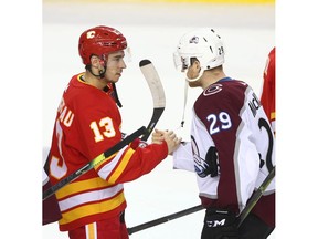 Flames Johnny Gaudreau (L) shakes hands with Nathan MacKinnon following game five between the Colorado Avalanche and Calgary Flames in Calgary on Friday, April 19. File photo by Jim Wells/Postmedia