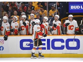 Calgary Flames centre Derek Ryan (10) celebrates with teammates after scoring a goal against the Nashville Predators during the first period at Bridgestone Arena. Photo by Steve Roberts/USA TODAY Sports.