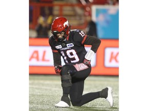 Calgary Stampeder QB Bo Levi Mitchell winces as he rises from the turf during CFL action in Calgary on Friday, October 11, 2019. Jim Wells/Postmedia