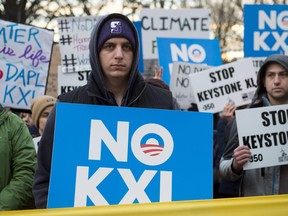 Opponents of the Keystone XL and Dakota Access pipelines hold a rally as they protest US President Donald Trump's executive orders advancing their construction, at Lafayette Park next to the White House, on January 24, 2017.