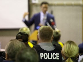 RCMP members attend a town hall meeting on rural crime held by Justice Minister Doug Schweitzer at the Leduc Civic Centre on Tuesday, Oct. 15, 2019.