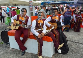 An image of a young mariachi band with their faces painted for the Day of the Dead grand parade in Puerto Vallarta, Mexico.