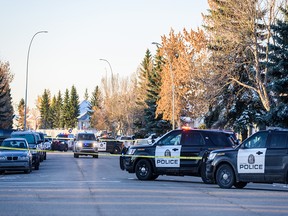Police investige the scene of a home invasion in Monterey Park in northeast Calgary on Thursday, Oct. 10, 2019.