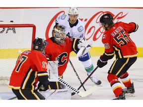 Calgary Flames goalie Cam Talbot with a save against the Vancouver Canucks during pre-season NHL hockey in Calgary on Monday September 16, 2019. Al Charest / Postmedia