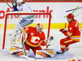 Calgary Flames goalie David Rittich with a save against the Vancouver Canucks during NHL hockey in Calgary on Saturday October 5, 2019. Al Charest / Postmedia