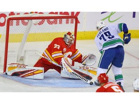 Calgary Flames goalie David Rittich with a save on a shot by Micheal Ferland of the Vancouver Canucks during NHL hockey in Calgary on Saturday October 5, 2019. Al Charest / Postmedia