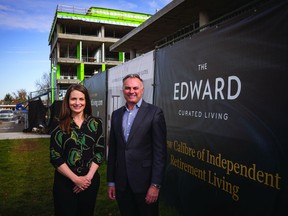 Chris Plosz, president of Section 23, and his senior vice-president Marion Murray, outside the under-construction The Edward.