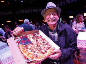 Bearcat Murray during the Eric Francis Pizza Pigout,  an event where Calgary’s finest celebrities, hundreds of hungry pizza lovers & foodies will come together to taste over 600 pizzas donated by local pizzerias. The night is filled with carbs, beer and general mayhem – a good time is had by all while raising money for KidSport Calgary and their partner charities in Calgary on Wednesday, October 16, 2019. Darren Makowichuk/Postmedia