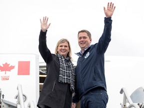 Conservative Leader Andrew Scheer and his wife Jill prepare to board his campaign plane in Ottawa, Monday, Oct. 14, 2019.