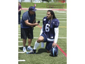 Toronto Argos Marcus Ball LB (6) takes a knee as he speaks with Toronto Sun CFL reporter Frank Zicarelli  during an interview after practice in Toronto, Ont. on Wednesday May 30, 2018. Jack Boland/Toronto Sun/Postmedia Network