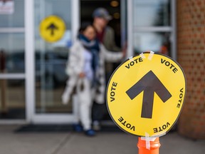 Voters exit South Gate Alliance Church in Calgary on Monday, Oct. 21, 2019.