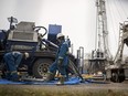 Imperial Oil rig workers in Redwater, Alta., on Oct. 30, 2014.