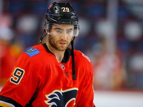 Calgary Flames Dillon Dube during warmup before facing the Winnipeg Jets during pre-season NHL hockey in Calgary on Tuesday September 24, 2019. Al Charest / Postmedia