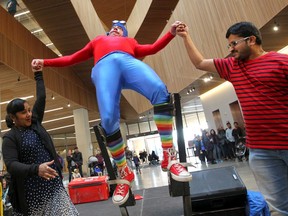 "Gustavo the Impossiblist" with The Green Fools puts on stilts for a comedy performance as the Central Library celebrates its 1st birthday on Saturday, November 2, 2019. Brendan Miller/Postmedia