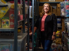 Made by Momma Director and President Allyson Palaschuk poses for a photo inside the organization's birthday inventory on Monday, November 11, 2019. Azin Ghaffari/Postmedia Calgary