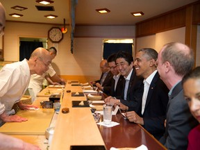 President Barack Obama and Prime Minister Shinzo Abe of Japan talk with sushi master Jiro Ono, owner of Sukiyabashi Jiro sushi restaurant, during a dinner in Tokyo, Japan, April 23, 2014. (Official White House Photo by Pete Souza)