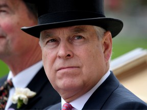 FILE PHOTO: Britain's Prince Andrew arrives by horse and carriage on ladies day at Royal Ascot, June 20, 2019.