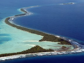 The South Pacific pounds the serpentine coastline of Funafuti Atoll, 19 February 2004, home to nearly half of Tuvalu's entire population of 11,500.