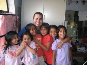Ranny Shibley, president and CEO of RJS Capital, with some of the orphanage children his foundation supports in Mexico. Supplied photo.