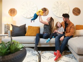 Bryan Masson and Jessica Calloway play with their kids.