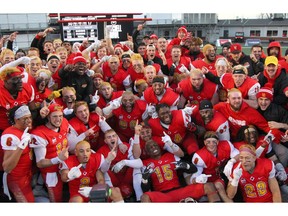 Members of the Calgary Dinos celebrate after winning the 2019 Mitchell Bowl after the Dino's beat the McMaster Marauders 30-17 at home from McMahon Stadium on Saturday, November 16, 2019. Brendan Miller/Postmedia