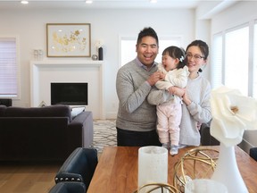 Philip Wu and Lingyun Zou with their daughter Zoe, 1, fell in love with a Truman Homes' show home in Carrington South.