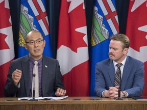 Jason Luan, the associate minister of Mental Health and Addictions and Health Minister Tyler Shandro outlined the proposed legislation to support Alberta's participation in the proposed national class action against opioid manufacturers and wholesalers on November 21, 2019. Photo by Shaughn Butts / Postmedia