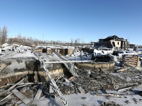 The burnt out remains of a house on the western outskirts of Calgary which burned to the ground is shown Saturday, November 30, 2019. The fire  occurred late Friday afternoon. Jim Wells/Postmedia