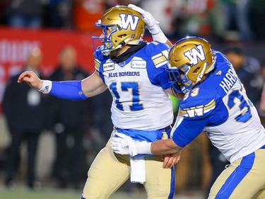 Winnipeg Blue Bombers Andrew Harris celebrates after his touchdown with teammate Chris Streveler against the Hamilton Tiger-Cats during the 107th Grey Cup CFL championship football game in Calgary on Sunday, November 24, 2019. Al Charest/Postmedia