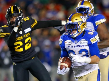Winnipeg Blue Bombers Andrew Harris carries the ball against the Hamilton Tiger-Cats during the 107th Grey Cup CFL championship football game in Calgary on Sunday, November 24, 2019. Al Charest/Postmedia
