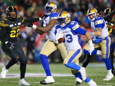 Winnipeg Blue Bombers Andrew Harris carries the ball against the Hamilton Tiger-Cats during the 107th Grey Cup CFL championship football game in Calgary on Sunday, November 24, 2019. Al Charest/Postmedia