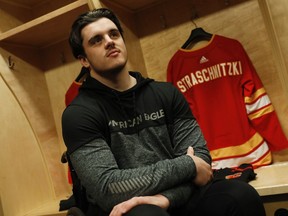 Former Humbolt Bronco hockey player Ryan Straschnitzki who was injured in a team bus crash gets his new jersey with PX3 AMP hockey team in Calgary, Wednesday, Oct. 30, 2019. A hockey player paralyzed in the Humboldt Broncos bus crash has received the spinal surgery in Thailand that could help restore some of his movement. Ryan Straschnitzki, who is paralyzed from the chest down, and 12 others were injured when a semi truck blew through a stop sign and into the path of the Saskatchewan junior hockey team's bus in April 2018. Sixteen people died.