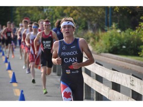 Courtesy, Kevin Pennock/ Calgary Herald CALGARY, AB --JULY 21, 2014 -- Russell Pennock was photographed during the running leg of the Canadian Junior National Championship Triathalon. Courtesy, Kevin Pennock/Calgary Herald)