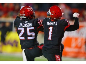 Calgary Stampeders Hergy Mayala celebrates with teammate Don Jackson after his touchdown against the Saskatchewan Roughriders during CFL football in Calgary on Friday, October 11, 2019. Al Charest/Postmedia