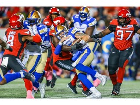 Calgary Stampeders defence takes down quarterback Chris Streveler of the Winnipeg Blue Bombers during CFL football in Calgary on Saturday, October 19, 2019. Al Charest/Postmedia