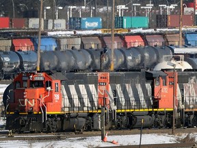 Locomotives move through the Canadian National (CN) railyards in Edmonton. About 3,000 workers of the country's largest railroad operator, went on strike on Tuesday.
