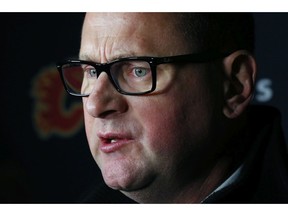 Calgary Flames GM Brad Treliving addresses the media following an NHL hockey practice Tuesday, Nov. 26, 2019, in Buffalo, N.Y. Treliving says Flames coach Bill Peters remains on the staff but wasnÕt certain whether heÕd be behind the bench for the next game. The team and the NHL are both investigating an allegation the Peters directed racial slurs at a player 10 years ago when the two were in the minors. Akim Aliu, a Nigerian-born player, says Peters Òdropped the N bomb several timesÓ in a dressing room during his rookie year.(AP Photo/Jeffrey T. Barnes) ORG XMIT: NYJB107