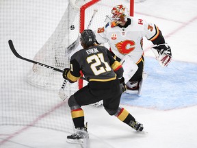 Vegas Golden Knights centre Cody Eakin buries the puck behind Calgary Flames goaltender Cam Talbot on Sunday, Nov. 17, at T-Mobile Arena.