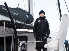 Swedish climate activist Greta Thunberg stands aboard the catamaran La Vagabonde as she sets sail to Europe in Hampton, Virginia, on Nov. 13, 2019.