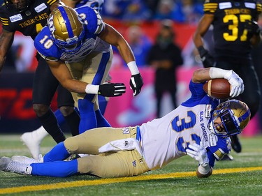 Andrew Harris of the Winnipeg Blue Bombers goes in for a touchdown during the 107th Grey Cup CFL championship football game in Calgary on Sunday, November 24, 2019. Al Charest/Postmedia