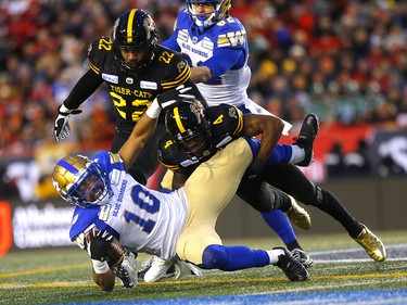 Winnipeg Blue Bombers, Nic Demski is tackled by Hamilton Tiger-Cats, Nic Demski in first half action at McMahon stadium during the 107th Grey Cup in Calgary on Sunday, November 24, 2019. Darren Makowichuk/Postmedia