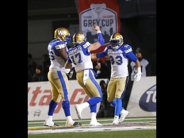 Winnipeg Blue Bombers, Andrew Harris celebrates a TD in first half action against the Hamilton Tiger Cats at McMahon stadium during the 107th Grey Cup in Calgary on Sunday, November 24, 2019. Darren Makowichuk/Postmedia