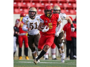 University of Calgary Dinos receiver Jalen Philpot returns a 97-yard punt for a touchdown in the Dinos' narrow 47-46 Hardy Cup semifinal victory over the University of Manitoba Bisons at McMahon Stadium on Saturday. Photo by SEAN LIBIN / Special to Postmedia.
