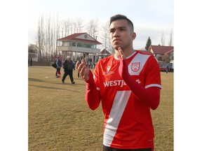 Cavalry FC Jose Escalante salutes the fans during Leg 2 Canadian Premier League Championship soccer action between Forge FC and Cavalry FC at ATCO Field at Spruce Meadows in Calgary on Saturday. Forge won 1-0 and takes home the league championship. Photo by Jim Wells/Postmedia.