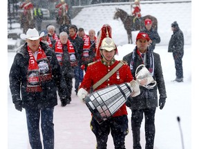 The Grey Cup is paraded down Stephen Avenue mall to the Olympic Plaza to kick off the 107th Grey Cup festivities in Calgary on Tuesday. Photo by Darren Makowichuk/Postmedia.